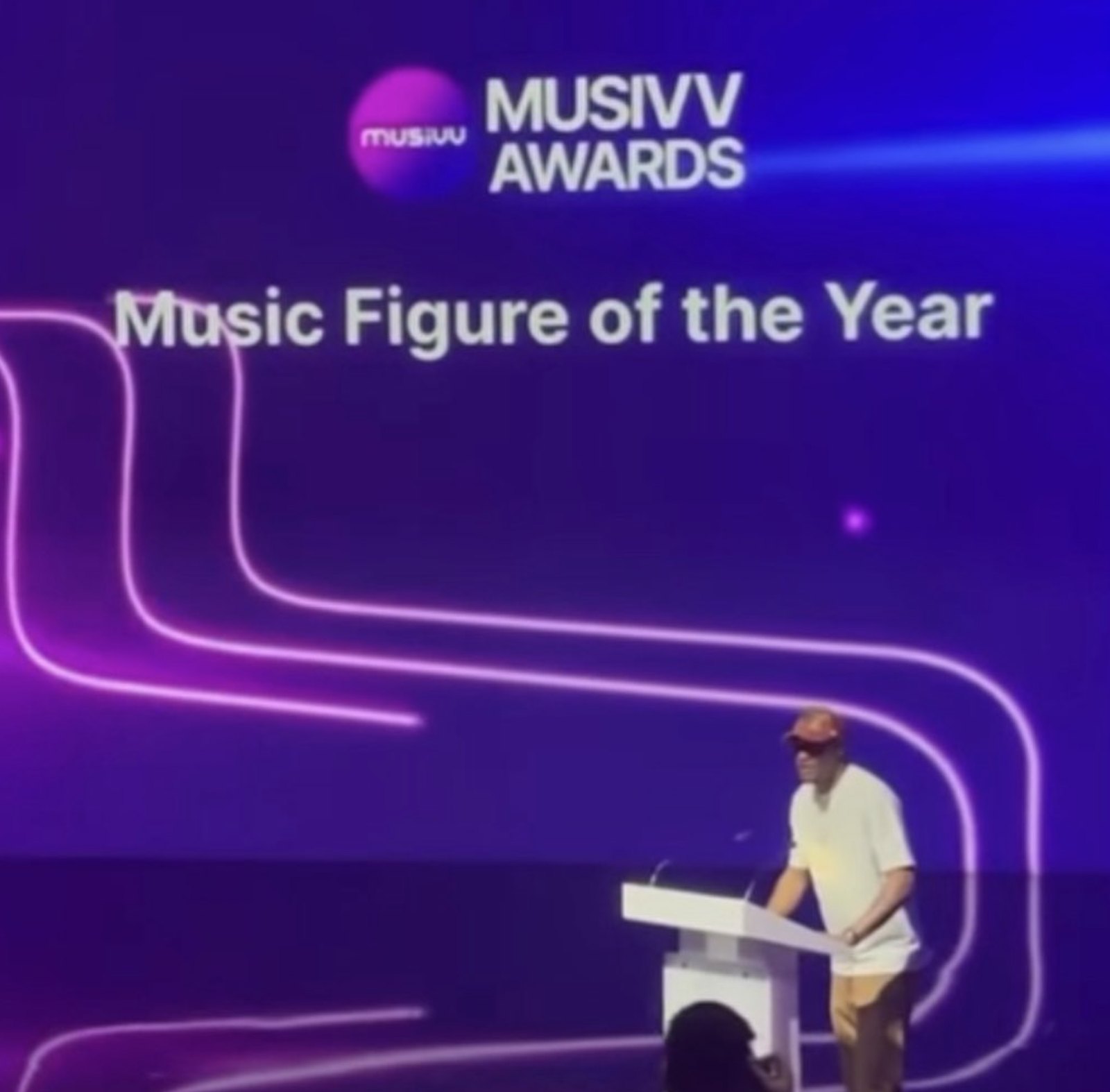 Albert M. Carter presenting an award on stage